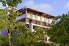 Modern home with Exterior, Metal Siding Material, Flat RoofLine, House Building Type, Metal Roof Material, and Curved RoofLine. Jalousie windows at Guest House by Miró Rivera Architects Photo 5 of Guest House