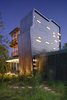 Modern home with Outdoor, Landscape Lighting, Trees, Side Yard, Walkways, Grass, Shrubs, and Gardens. Exterior view at Guest House by Miró Rivera Architects Photo 11 of Guest House