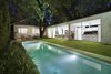 Modern home with Outdoor, Large Pools, Tubs, Shower, Lap Pools, Tubs, Shower, Grass, Stone Patio, Porch, Deck, Back Yard, Standard Construction Pools, Tubs, Shower, Landscape Lighting, Gardens, Concrete Pools, Tubs, Shower, Trees, and Side Yard. Lap pool at the 1917 Bungalow by Miró Rivera Architects Photo 8 of 1917 Bungalow