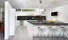 Modern home with Kitchen, Microwave, Open Cabinet, Stone Counter, Dishwasher, Refrigerator, Range Hood, Wall Oven, Metal Cabinet, Ceiling Lighting, White Cabinet, Stone Slab Backsplashe, Range, Undermount Sink, and Porcelain Tile Floor. Kitchen at the 1917 Bungalow by Miró Rivera Architects Photo 9 of 1917 Bungalow