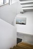 Modern home with Staircase, Metal Railing, Wood Railing, and Wood Tread. From the spaces around it, the stair provides a dramatic focal point, revealing itself in curious and contradictory ways. Photo 11 of Vista Residence