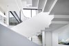 Modern home with Staircase, Wood Tread, Metal Railing, and Wood Railing. Assembled from 5/8” thick plate steel with white oak treads, the staircase took eight months to fabricate, assemble, and paint. Photo 17 of Vista Residence