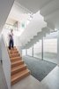 Modern home with Staircase, Metal Railing, Wood Tread, and Wood Railing. The largest single piece of steel in the staircase is 17 feet long and 10 feet tall. Photo 18 of Vista Residence