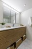 Modern home with Bath Room, Engineered Quartz Counter, Concrete Floor, Undermount Sink, Enclosed Shower, Recessed Lighting, Concrete Wall, Ceiling Lighting, and Two Piece Toilet. Custom floating wooden vanity with recess medicine cabinet , white micro cement walls , and concrete floors By Nathalie Milazzo Photo 6 of Riviera Miami Beach
