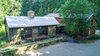 Modern home with Exterior, House Building Type, Metal Roof Material, and Wood Siding Material. front exterior Photo of Contemporary Farmhouse