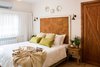 Modern home with Bedroom, Bed, Night Stands, Wall Lighting, and Ceramic Tile Floor. The main sleeping area Photo of Golden apple guest rooms