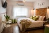Modern home with Living Room and Ceramic Tile Floor. The main sleeping area with a small sitting Photo 3 of Golden apple guest rooms