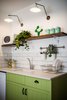 Modern home with Kitchen, Tile Counter, Colorful Cabinet, Wood Cabinet, Ceramic Tile Backsplashe, Wall Lighting, Microwave, Drop In Sink, and Ceramic Tile Floor. Compact kitchen Photo 7 of Golden apple guest rooms