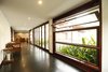 Most of the walls are made up of openable/foldable/pivoted/fixed glass walls thus letting natural air and natural light flood every corner of the house. This has helped in reducing the need for artificial lighting loads drastically. The house remains well lit by natural light even up to 7 p.m., especially in summer months. Photo 8 of The Flying House modern home