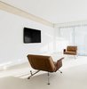Modern home with Living Room, Chair, Ceiling Lighting, Travertine Floor, and Porcelain Tile Floor. WH Residence | M3 Architects Photo 14 of WH Residence