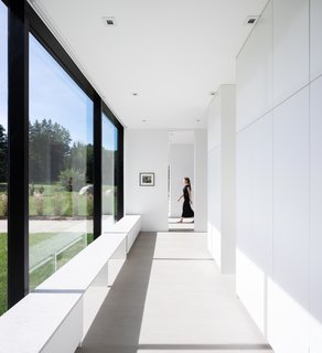 The entire home is encased in glass and soaked in natural light.