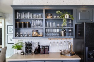 Open shelving provides a rustic touch and a place to store some of the family's beautiful kitchenware. 