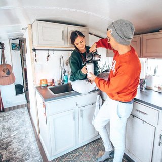 Chase and Mariajosé enjoying coffee in the kitchen.