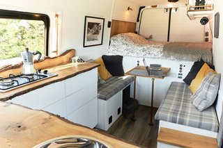 The view of the sitting area and bed from the sink.