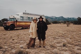 Jeffrey and Britt in front of their bus. 