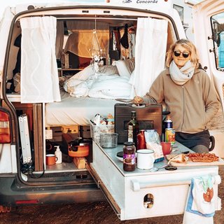 Schmidt dining at her pull-out kitchen.
