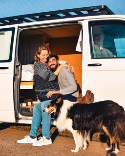 The lovebirds and Cleo in front of the van.