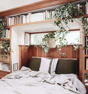 Morris' bedroom exudes all the cozy vibes with plants and a pure linen coverlet from Rough Linen.