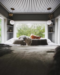 The bedroom is immersed in views. 