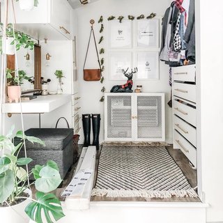 Maximizing space is key. Here, she's placed many options for storage in an alabaster hue so the space still feels open. 