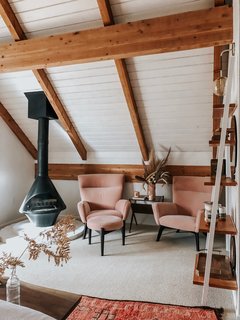 "I wanted something elegant and soothing, but still with a pop of color, so I added the high-backed Boden chairs in Vance Rose with a little ottoman." The seating is from Room & Board.