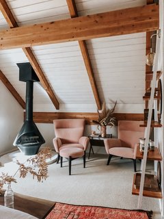 “I wanted something elegant and soothing, but still with a pop of color, so I added the high-backed Boden chairs in Vance Rose with a little ottoman.” The seating is from Room & Board.