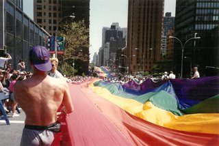 A rainbow flag going up 1st Ave.