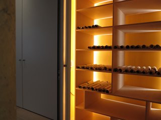 An archive of Mill's father's scroll paintings sits in the penthouse. The design is inspired by a temple gate in Kyoto, Japan. This archive functions also as illumination for the corridor in the penthouse. 