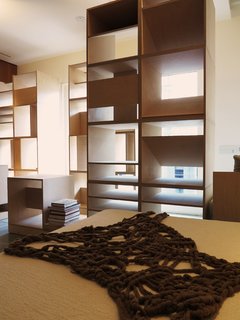The bedspread fragment in the penthouse is a custom-knitted piece by fashion designer McKaela Christenson.