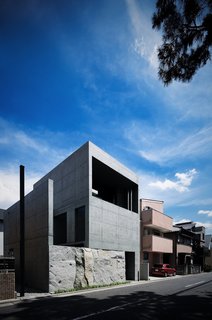 A view of the exterior of the concrete live/work space. 