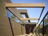 Modern home with Exterior, Wood Siding Material, Flat RoofLine, and House Building Type. View of Entry Photo of The Brucato House