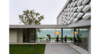 Modern home with Bench, Concrete Siding Material, House Building Type, Vinyl Siding Material, Outdoor, Field, Concrete Patio, Porch, Deck, and Planters Patio, Porch, Deck. Transparency and view of the Geneva lake Photo of House on the Lake