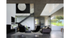 Modern home with Living Room, Sofa, Recliner, Pendant Lighting, Ceiling Lighting, Coffee Tables, Concrete Floor, and Standard Layout Fireplace. The living room and its void Photo 9 of House on the Lake