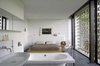 Modern home with Freestanding Tub, Wall Mount Sink, Bedroom, Bed, Concrete Floor, Floor Lighting, and Chair. The bedroom Photo 6 of Biscuit House