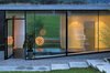 Modern home with Sliding Window Type, Metal, Exterior, Swing Door Type, House Building Type, Concrete Siding Material, Metal Siding Material, Exterior, Front Yard, and Green Roof Material. The entrance of the house Photo 2 of Biscuit House