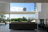 Modern home with Standard Layout Fireplace, Sofa, Concrete Floor, Windows, Sliding Window Type, and Metal. the livingroom overlooking the paysage Photo 2 of Chipster Blister House