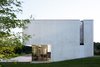 Modern home with Concrete Siding Material, House Building Type, Metal, Outdoor, Wood Patio, Porch, Deck, and Field. the love for contemporary forms Photo 8 of Chipster Blister House