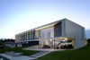 Modern home with House Building Type, Concrete Siding Material, Vinyl Siding Material, Outdoor, Wood Patio, Porch, Deck, and Field. chipster blister house Photo 9 of Chipster Blister House