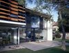 Modern home with Wood Patio, Porch, Deck, Front Yard, Horizontal Fences, Wall, Walkways, Concrete Siding Material, Wood Siding Material, Metal Siding Material, House Building Type, Windows, Sliding Window Type, and Metal. Seven and its wooden deck Photo of Seven