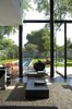 Modern home with Coffee Tables, Sofa, Concrete Floor, House Building Type, Metal Siding Material, Concrete Siding Material, Small Pools, Tubs, Shower, Lap Pools, Tubs, Shower, Windows, Concrete Pools, Tubs, Shower, Back Yard, Sliding Window Type, Metal, Picture Window Type, and Casement Window Type. the living room opening to the outside Photo 5 of Seven