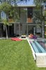 Modern home with Small Pools, Tubs, Shower, Swimming Pools, Tubs, Shower, Concrete Pools, Tubs, Shower, Wood Patio, Porch, Deck, Small Patio, Porch, Deck, Back Yard, Concrete Siding Material, House Building Type, Wood Siding Material, Windows, Sliding Window Type, and Metal. the house's pool Photo 2 of Seven