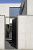 Modern home with Exterior, Concrete Siding Material, Metal Siding Material, Wood Siding Material, and House Building Type. the discrete entrance in the street Photo 6 of Seven