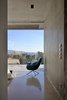 Modern home with Bedroom, Concrete Floor, Chair, Ceiling Lighting, Bed, and Recessed Lighting. A peek at the bedroom. Photo 6 of La Mira Ra
