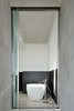 Modern home with Bath Room, Concrete Floor, Mosaic Tile Wall, Ceiling Lighting, and Freestanding Tub. The bathroom. Photo 17 of La Mira Ra