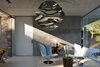 Modern home with Living Room, Sofa, Ceiling Lighting, Concrete Floor, Recessed Lighting, Pendant Lighting, Console Tables, End Tables, and Table Lighting. Entering the house. Photo 2 of La Mira Ra