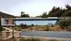 Modern home with Exterior, Stone Siding Material, Flat RoofLine, Metal Siding Material, Green Roof Material, Concrete Siding Material, House Building Type, and Glass Siding Material. A shell of concrete in the desert Photo of La Mira Ra