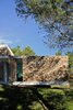Modern home with Exterior, Concrete Siding Material, Flat RoofLine, Green Roof Material, Wood Siding Material, Stone Siding Material, House Building Type, and Beach House Building Type. Stone and concrete. Photo 10 of La Mira Ra