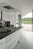 Modern home with Kitchen, Range, Ceiling Lighting, Range Hood, Pedestal Sink, Concrete Floor, Granite Counter, White Cabinet, and Recessed Lighting. The Kitchen Photo 8 of White Snake house