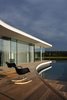 Modern home with Outdoor, Wood Patio, Porch, Deck, Infinity Pools, Tubs, Shower, Trees, Back Yard, Large Pools, Tubs, Shower, Large Patio, Porch, Deck, and Concrete Pools, Tubs, Shower. The deck Photo 16 of White Snake house