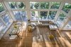 View of dining room and living room from second floor Photo 8 of Khabensky Residence modern home